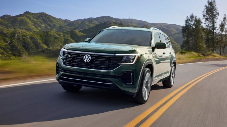 A green 2026 Volkswagen Atlas driving