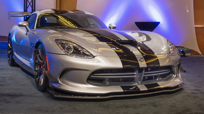 A metallic silver Dodge Viper SRT-10 sitting under a studio lighting.