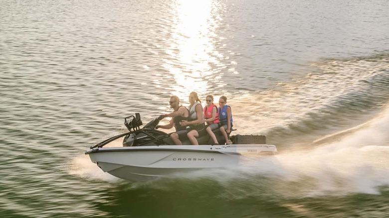 The Yamaha CrossWave carrying four people on a lake