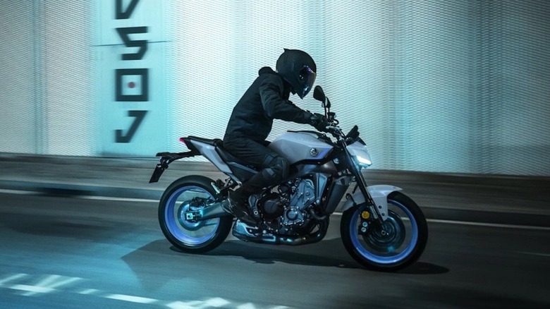 Yamaha MT-09 being ridden through the city at night