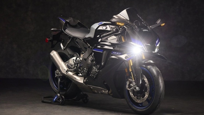 A black YZF-R1M on display with a black background