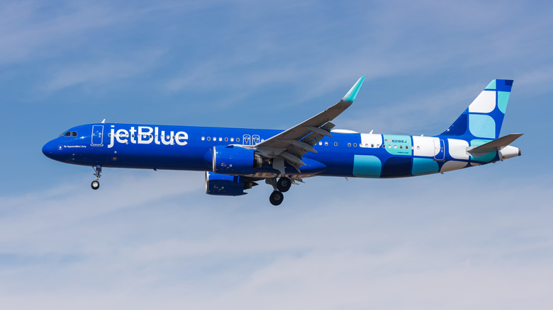 A JetBlue passenger plane in the sky