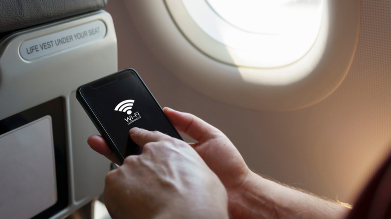 Person connecting to Wi-Fi on an airplane