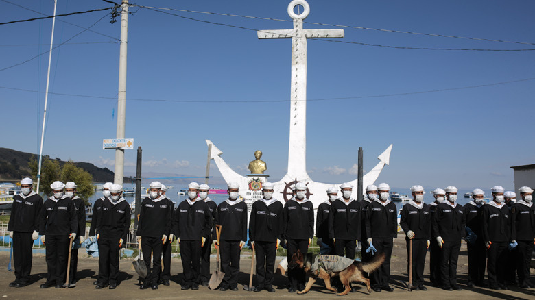 Bolivian navy personnel stand by the shore of Lake Titicaca.