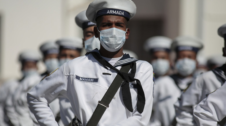 Bolivian navy personnel stand in formation.