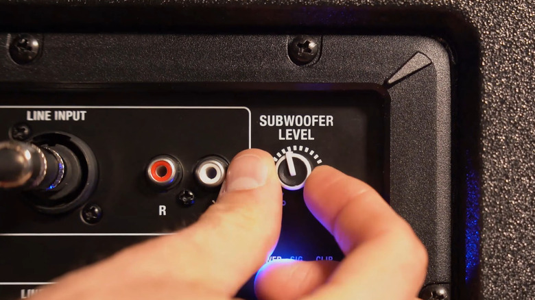 A close up of a line input, subwoofer level, and right/left inputs on a Rockville Audio sub.