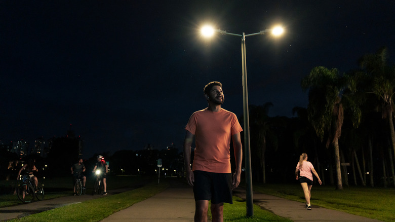 People under street light at night