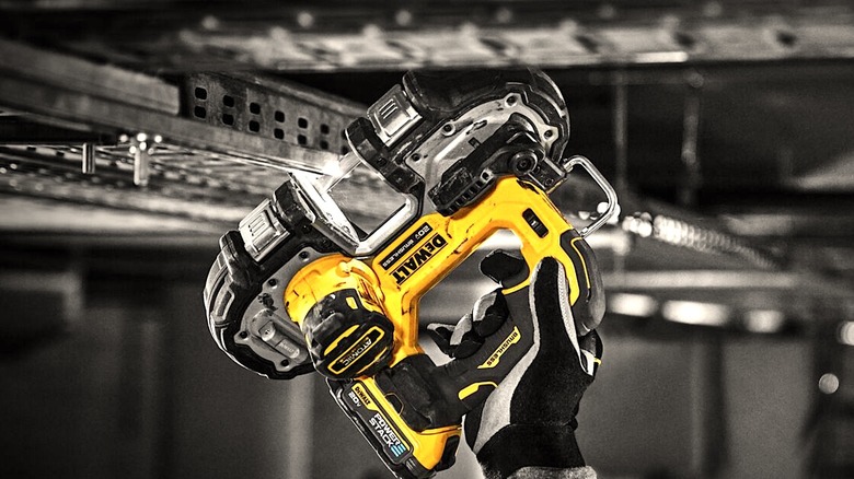 Person using cordless DeWalt power tool