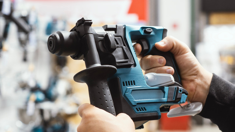 Hand holding power tool at power tool store