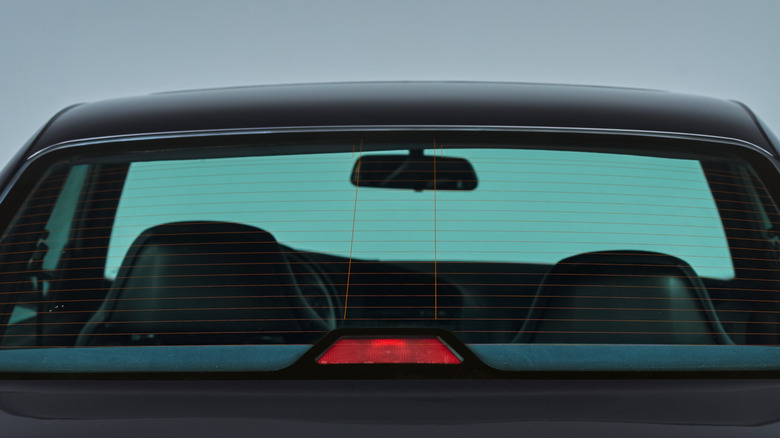 The rear window of a black car with a Center High‑Mounted Stop Lamp.