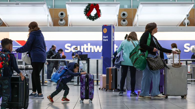 Travelers walk through the Southwest Airlines terminal at the Baltimore/Washington International Thurgood Marshall Airport