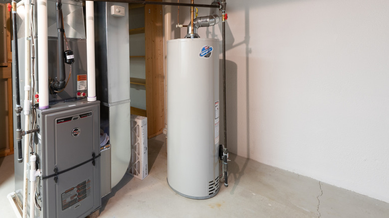 A hot water tank in a basement.