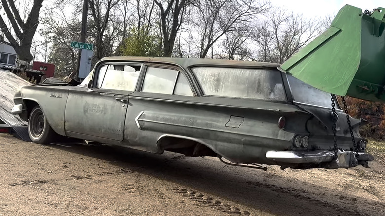 1960 Chevy being loaded off trailer