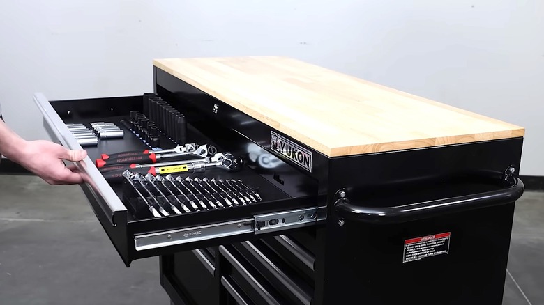 Person opening Yukon 9-drawer storage cabinet