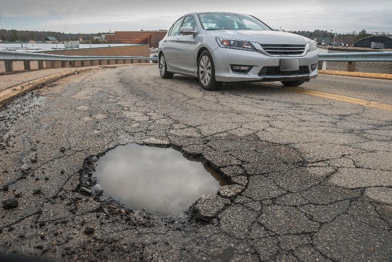 Car avoiding a pothole