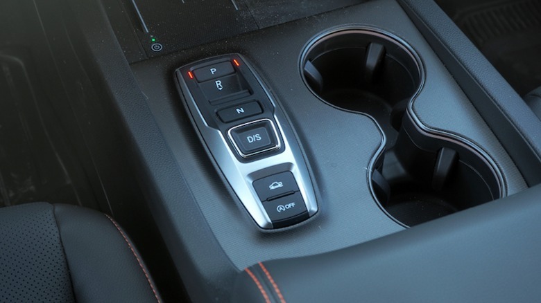Drive mode select and cupholders