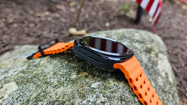 Samsung Galaxy Watch Ultra's left side while resting on a rock.