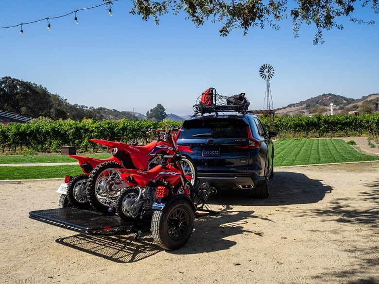 2023 Honda CR-V Hybrid parked with motorcycle trailer