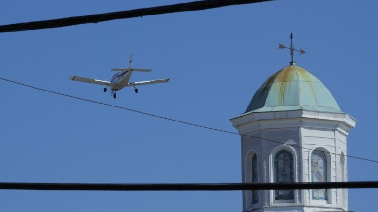plane flying by church