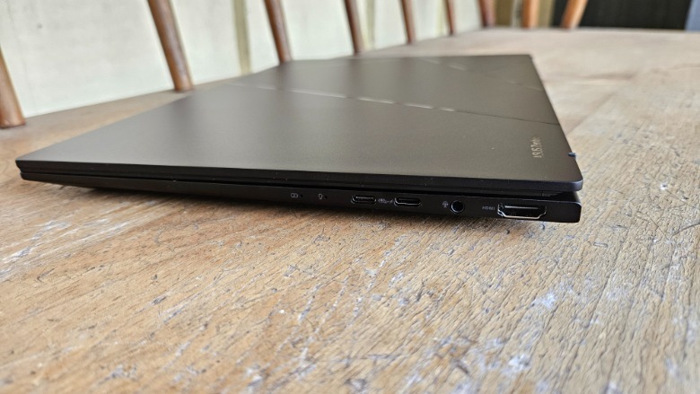 Zenbook 14 OLED 2024 on a bench with the lid closed showing off the I/O ports on the right side.