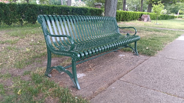Picture of a green bench in a park