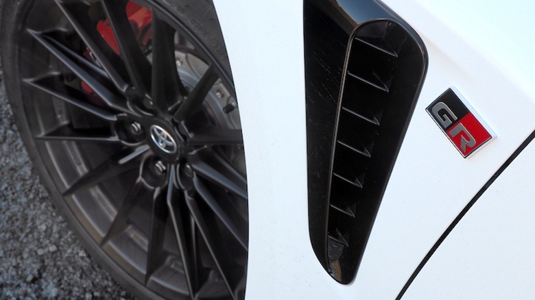 GR badge on front fender above vent and wheel