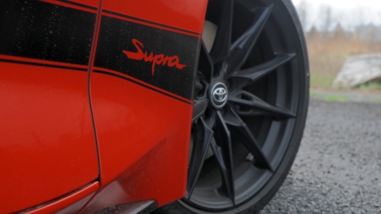 Supra badge and black wheel