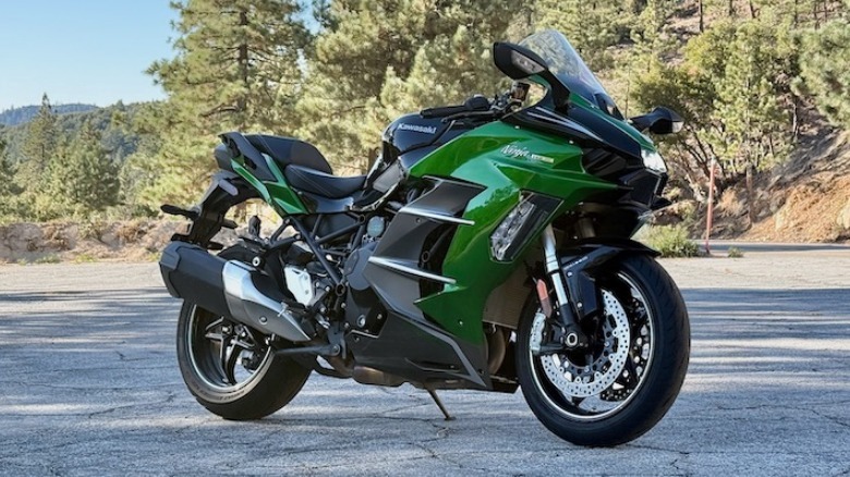 Kawasaki Ninja H2 SX parked in the mountains