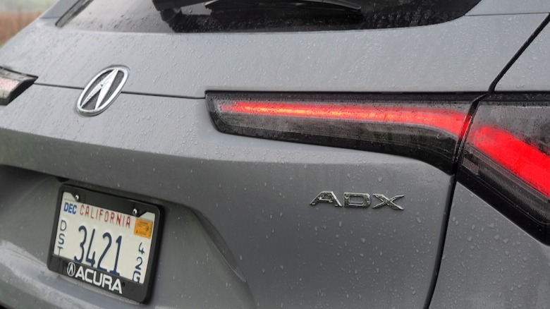 ADX badge on rear of crossover