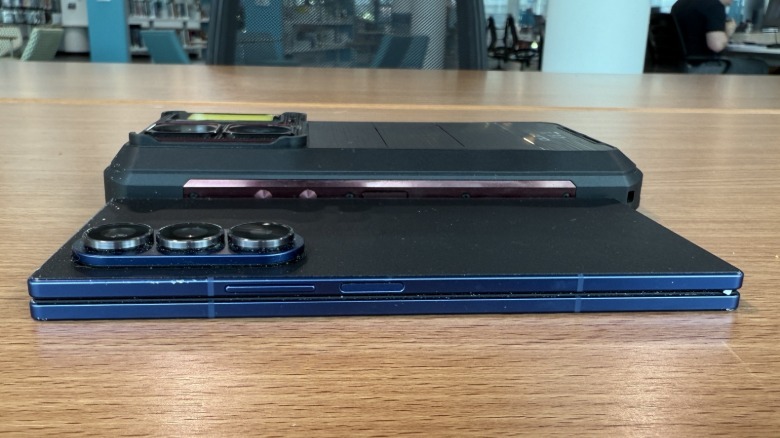 Oukitel phone next to a Samsung Galaxy Z Fold phone.