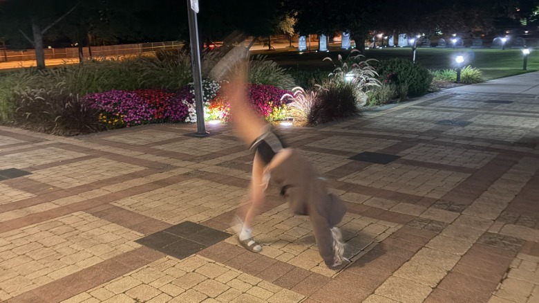Blurry image of a woman doing a cartwheel
