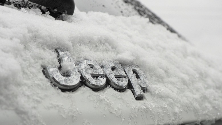 Jeep badge covered in snow