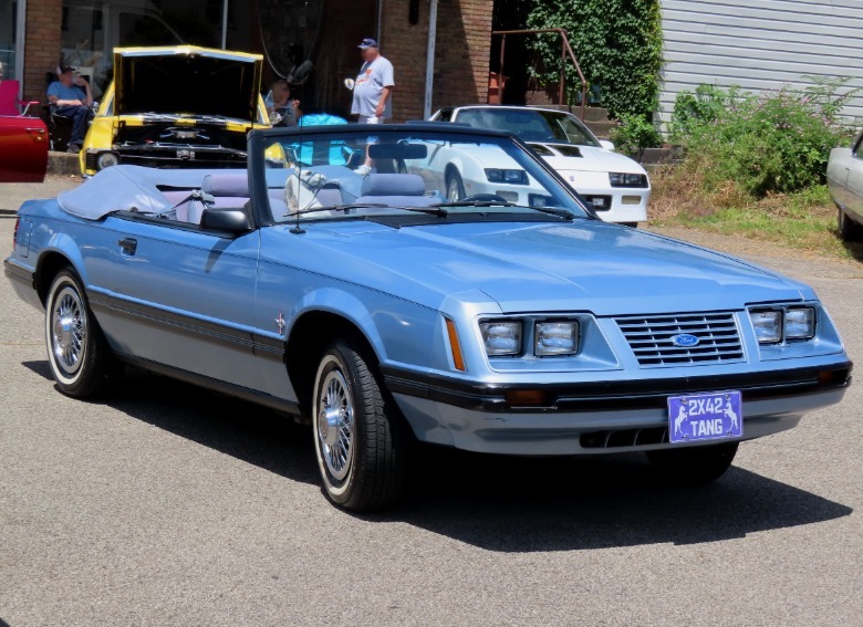 Blue 1983 Ford Mustang LX Convertible parked with top down