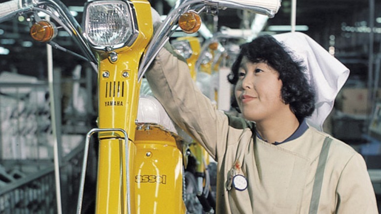 Yamaha Passol with a woman in the assembly line