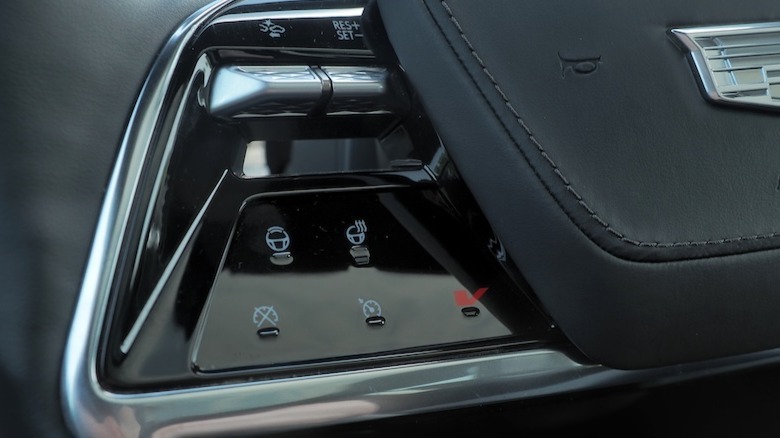 V Mode button on steering wheel