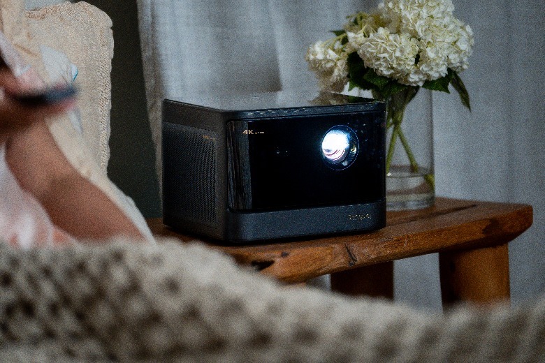 Dangbei DBOX02 on bedroom nightstand