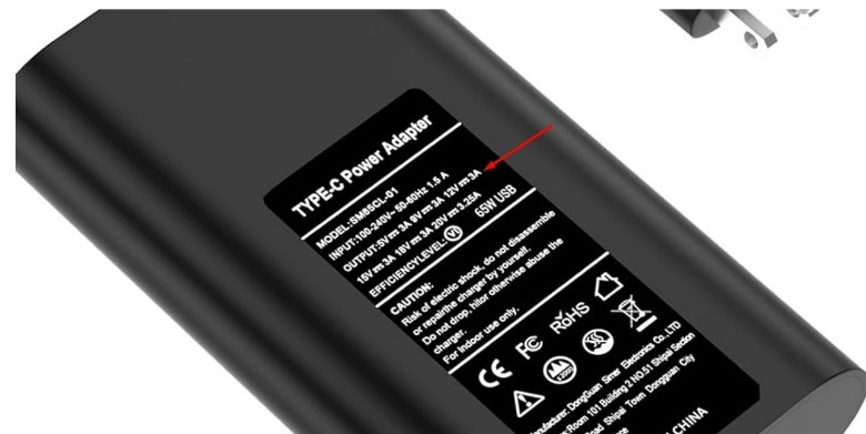 Power specification embedded on the back of a charger.