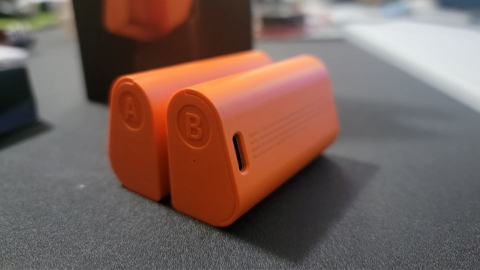 SwitchBot Lock Pro Dual Power Pack on black desk