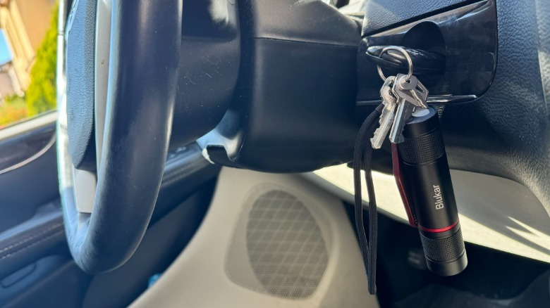 Blukar Flashlight is hanging with keys that are in the car ignition