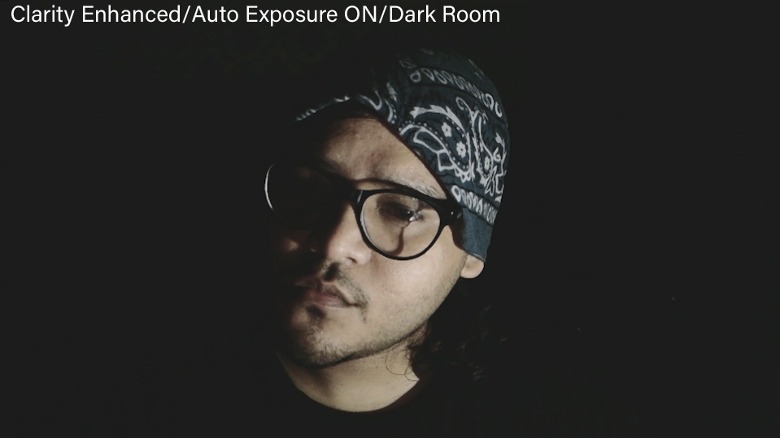 Image sample captured by the Obsbot Meet 2 camera in total darkness and lit only by laptop screen on the face.