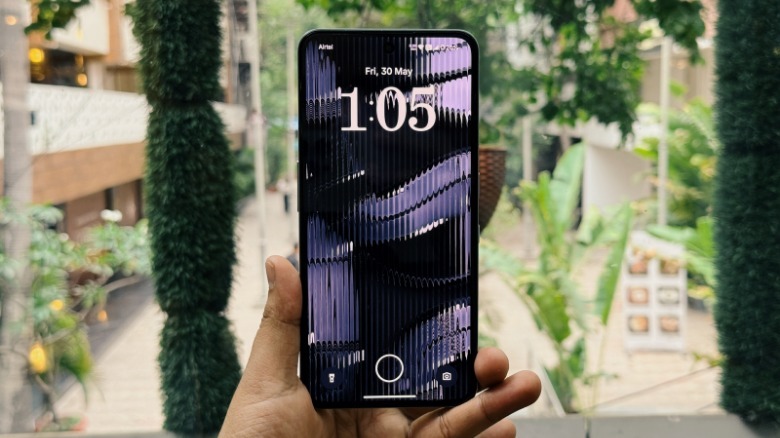 Holding the CMF Phone 2 Pro.