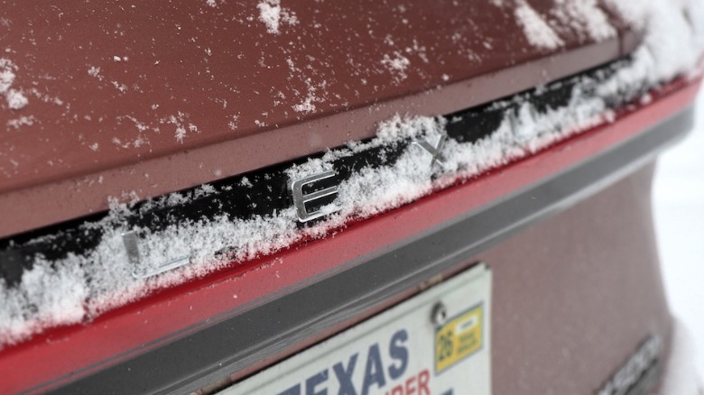 Lexus rear badge part-covered in snow