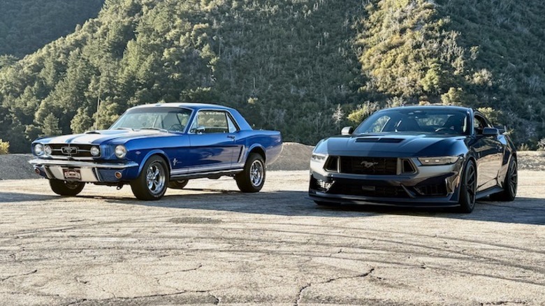 Classic Ford Mustang and Modern Ford Mustang parked side by side