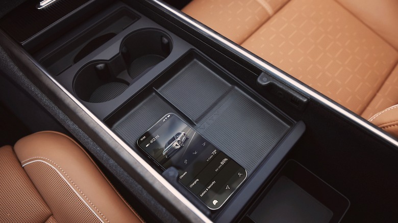 Gravity front row between-seat storage