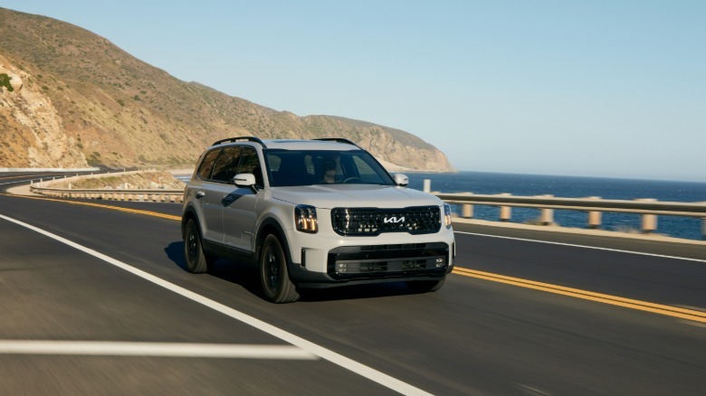 The 2024 Kia Telluride in gray on a coastal highway
